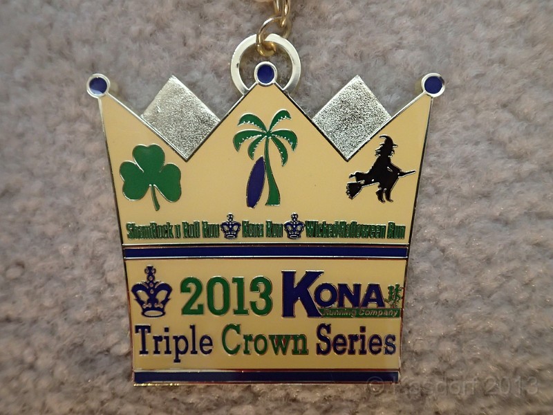 2013 Wicked 10K 285.JPG - The "Triple Crown Series" medal for completing all three races. Personally, a little underwhelmed by it. I would have thought it would be a little bigger than an individual race medal.
